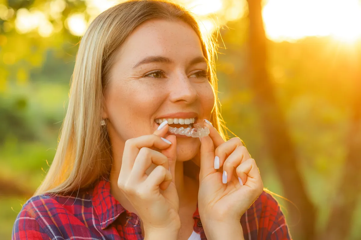 A patient at the end of Clarity™ Aligners treatment