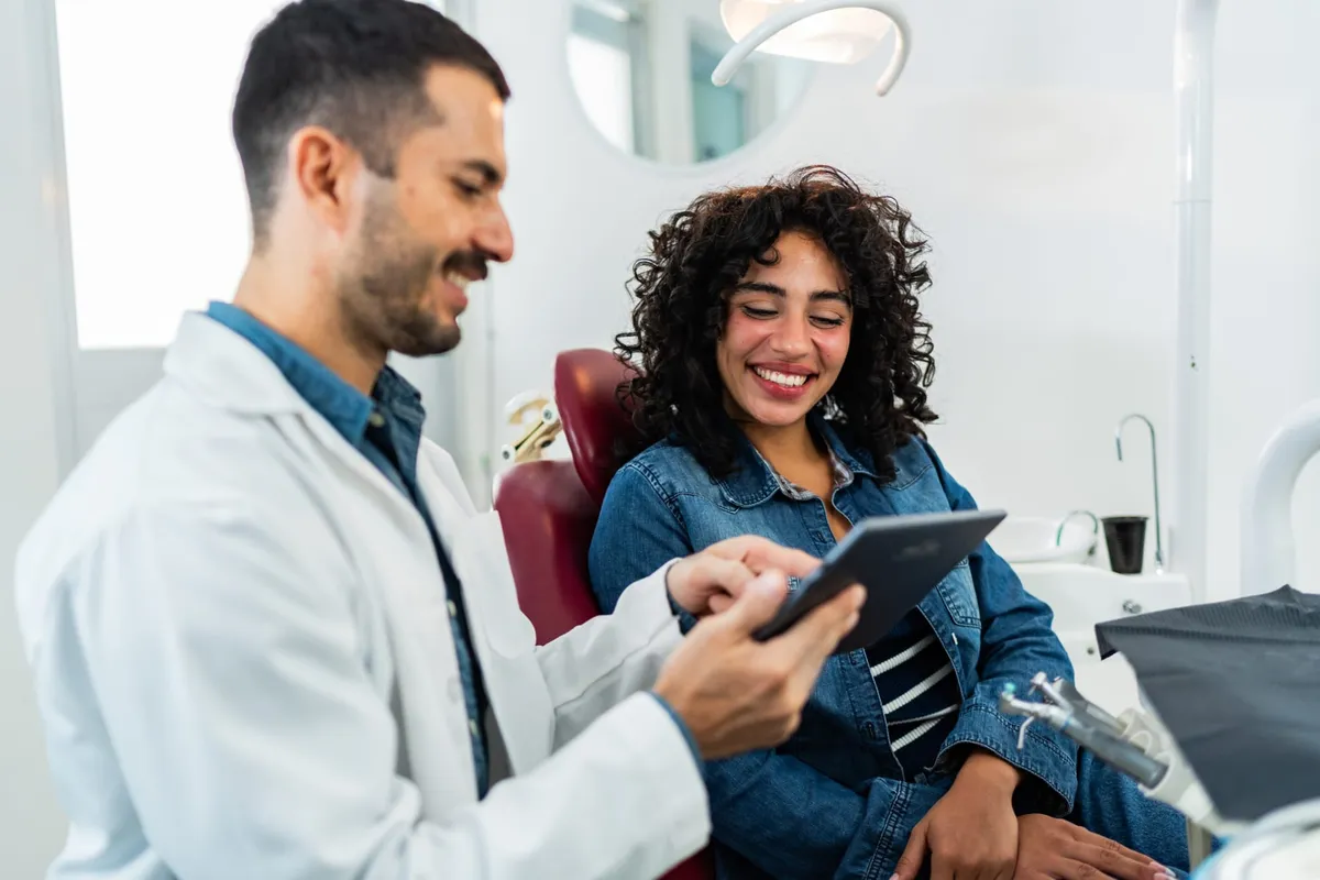 A patient discussing her treatment plan with her orthodontist