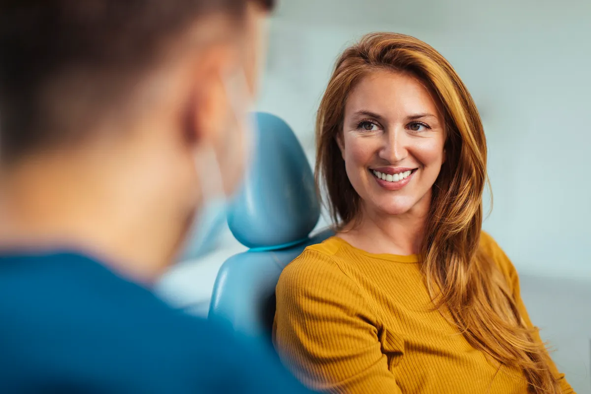 A patient talking with their Specialist Orthodontist at a consultation