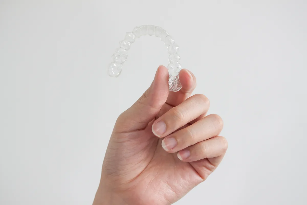 A clear retainer ready to wear